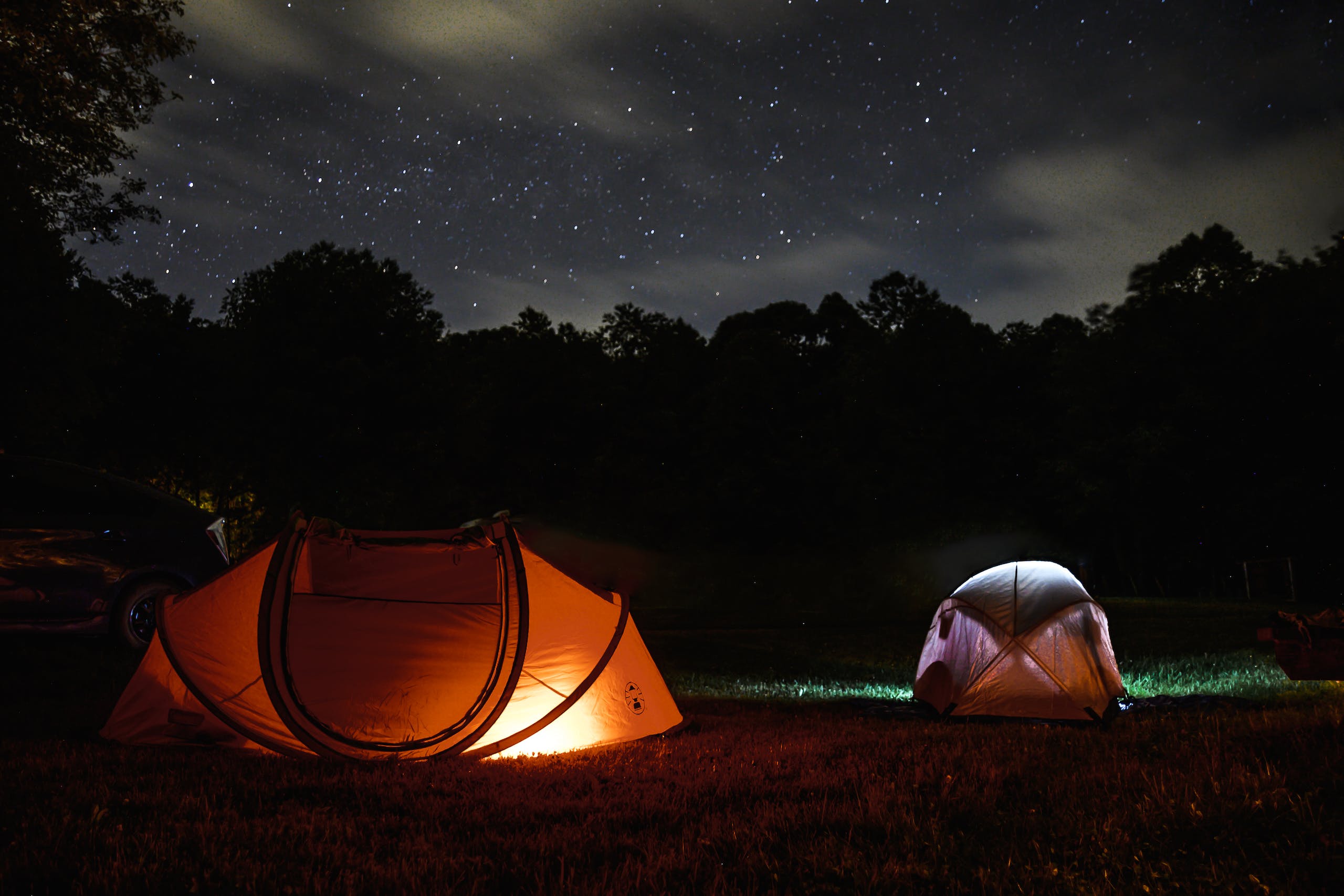 Two Lighted Dome Tent During Nighttime
